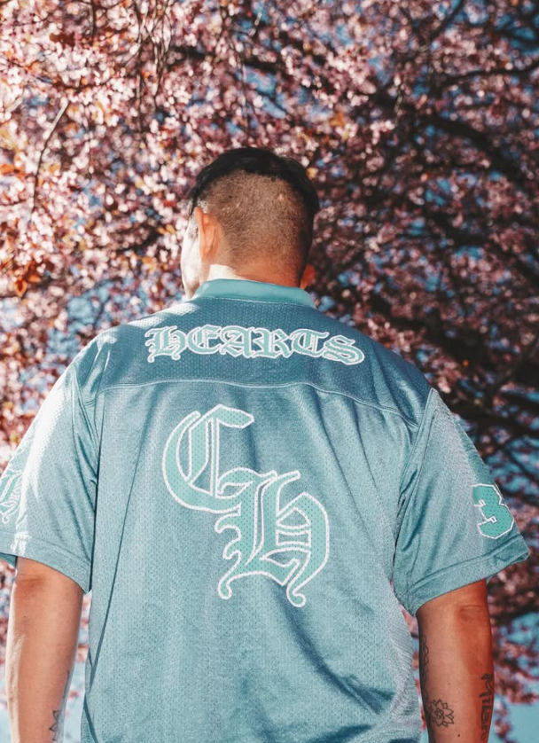 Old English Hearts mesh jersey under cherry blossoms